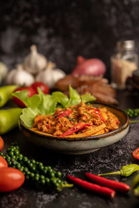 Close-up of chili peppers in bowl on table