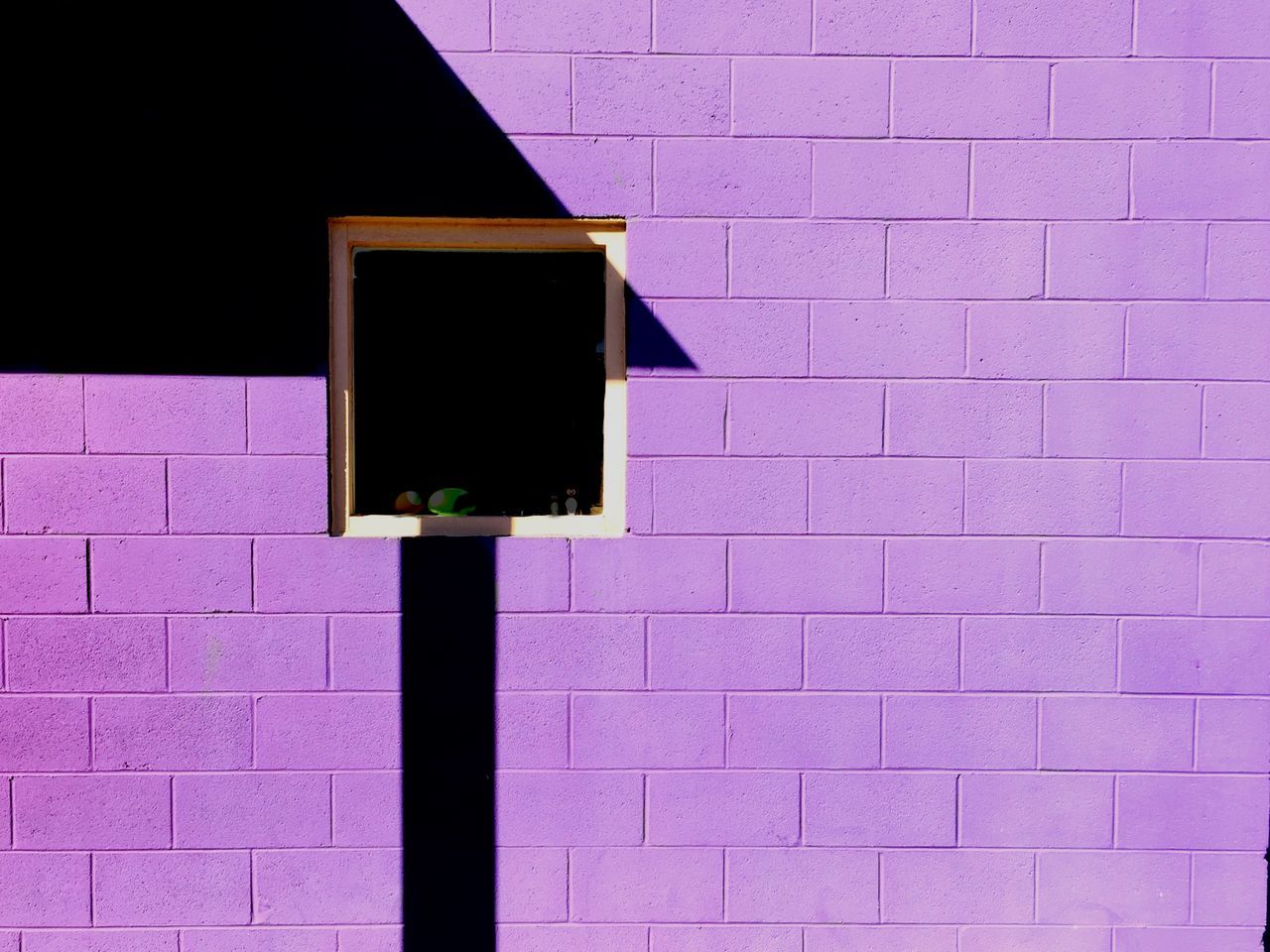 wall - building feature, built structure, architecture, brick wall, wall, building exterior, red, no people, close-up, textured, window, pattern, outdoors, day, blue, brick, house, shadow, full frame, sunlight