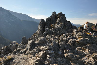 Rock formations on landscape against sky