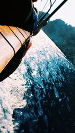 Low section of person on boat sailing in sea