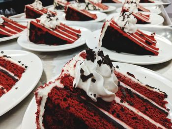 Cake slices in plates on table