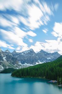 Scenic view of lake with mountain range in background