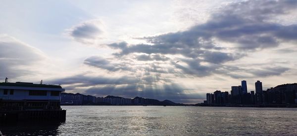 Panoramic view of sea and buildings against sky