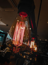 Low angle view of illuminated light bulb