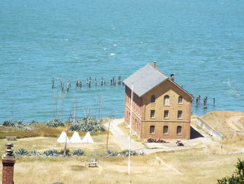 High angle view of houses on beach by sea