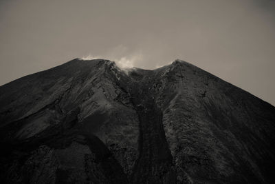 Low angle view of mountain against clear sky