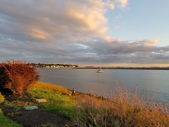 Scenic view of lake against sky during sunset