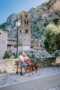 People sitting outside building