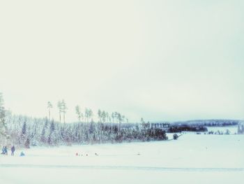 Scenic view of snow covered field against clear sky