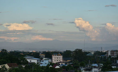 Smoke emitting from chimney against sky