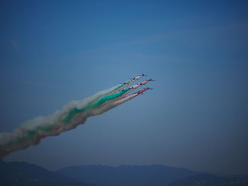 Airplane flying against blue sky