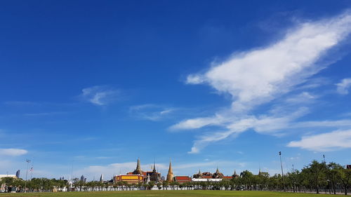 Low angle view of buildings against blue sky