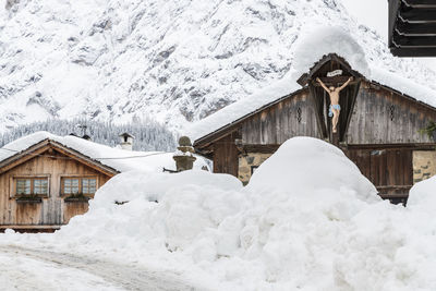 Snow magic. walk in the ancient village of sappada. friuli