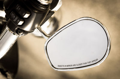 Text on side-view mirror of motorcycle