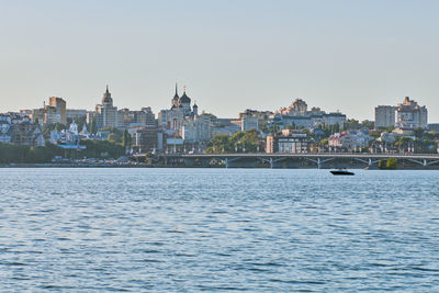 View of buildings in city against clear sky