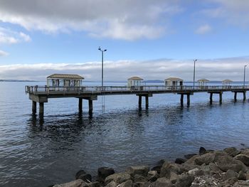 Pier over sea against sky