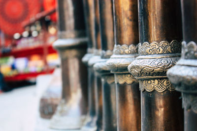 Close-up of religious bowls in temple