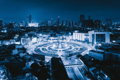 High angle view of illuminated buildings in city at night