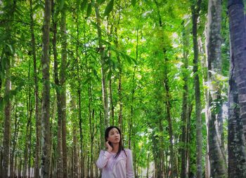 Portrait of young woman in forest