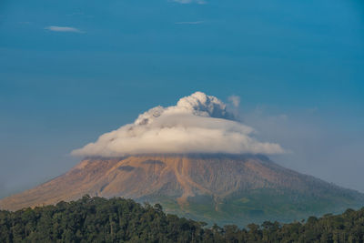 Scenic view of volcanic mountain against sky