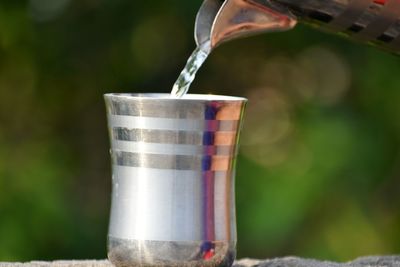 Close-up of water drops on metal container