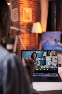 Man using laptop at home