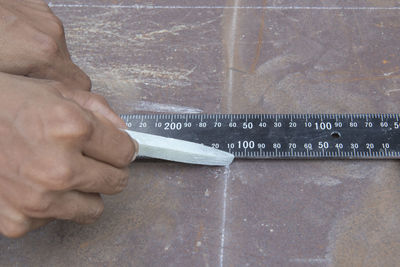 Low section of man working at construction site