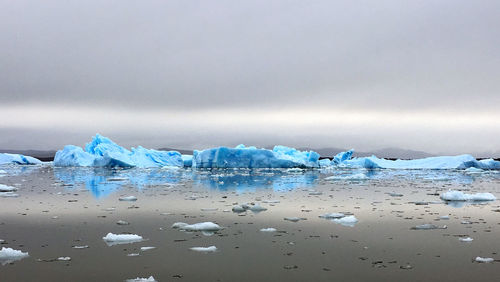 Scenic view of sea against sky during winter