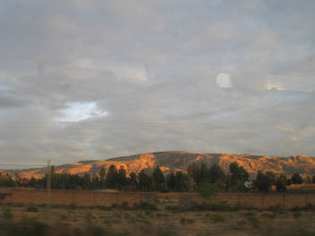 View of landscape against cloudy sky