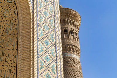 Low angle view of building against clear blue sky