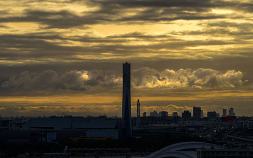 Low angle view of buildings against sky during sunset