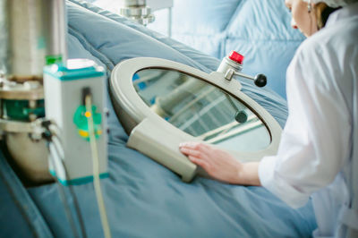 Close-up of female doctor working at hospital