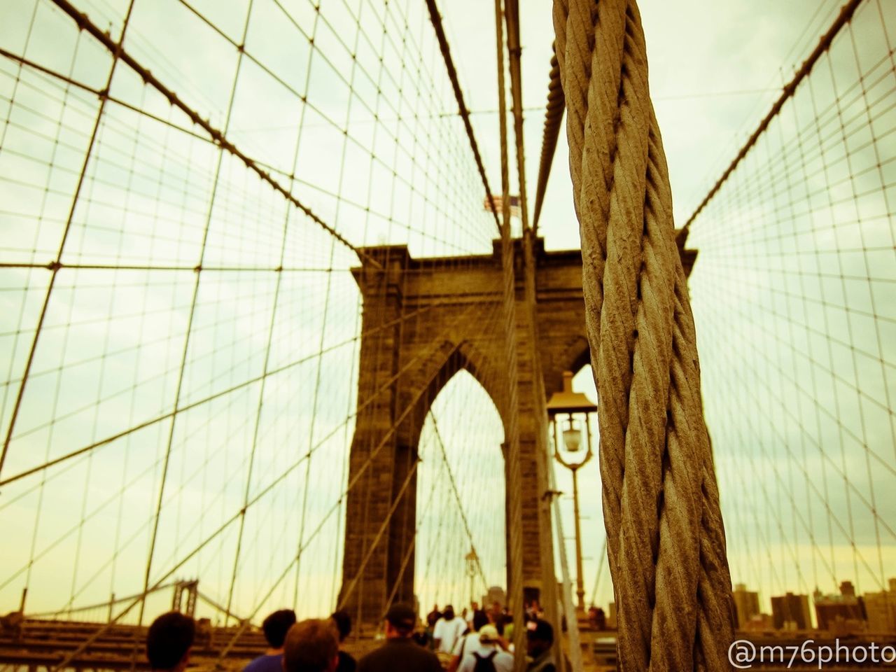 architecture, built structure, low angle view, famous place, large group of people, tourism, travel destinations, international landmark, connection, men, bridge - man made structure, arch, travel, leisure activity, engineering, capital cities, person, sky, lifestyles