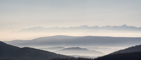 Scenic view of silhouette mountains against sky during sunset