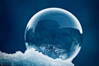 Close-up of ice crystals against blue background