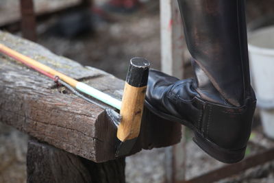 Low section of man leg on wood