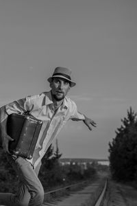 Young man standing against clear sky