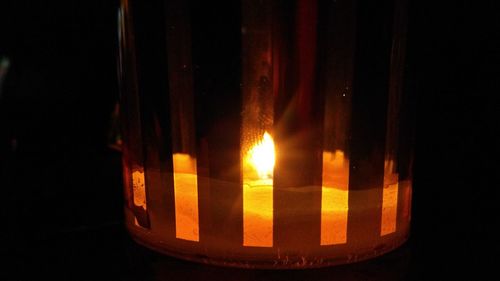 Close-up of illuminated candle