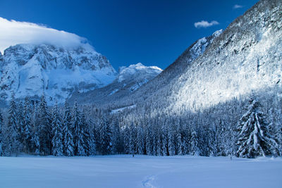 Scenic view of snowcapped mountains against sky