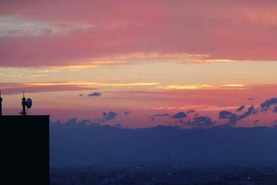 Silhouette of city during sunset