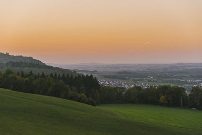 Scenic view of landscape against sky during sunset