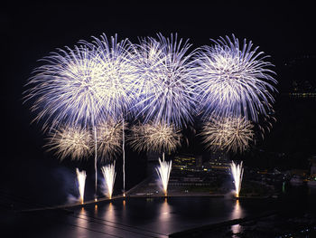 Firework display at night
