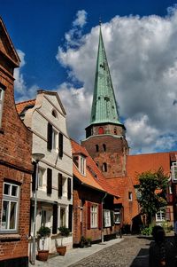 Low angle view of buildings in city against sky