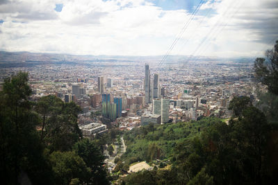 High angle view of buildings in city against sky