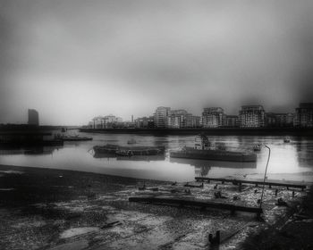 Cityscape against cloudy sky