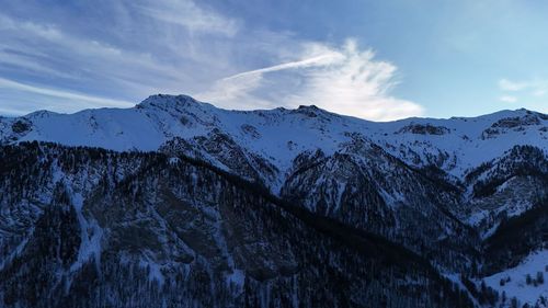 Scenic view of snowcapped mountains against sky
