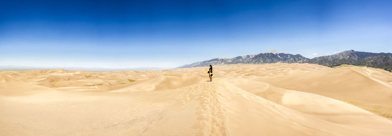 Woman at desert on sunny day