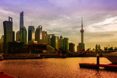 View of skyscrapers against cloudy sky