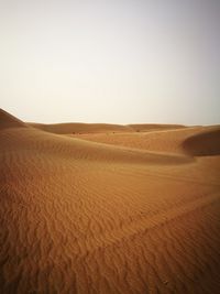 Scenic view of desert against clear sky