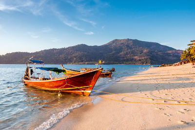 Longtail boat on a beach on koh lipe